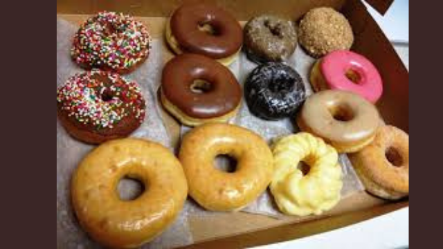 A box of donuts, with different toppings (13 of them)