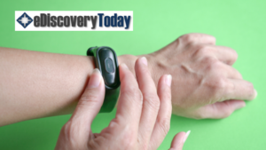 Fitbit on wrist with eDiscovery Today logo