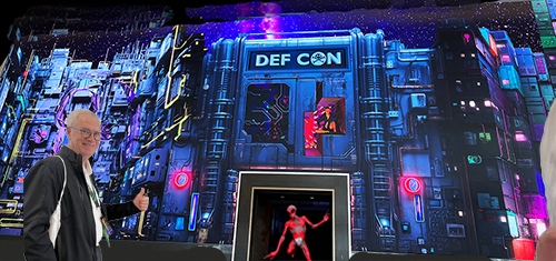 Ralph Lossy in front of Defcon 31 with alien.