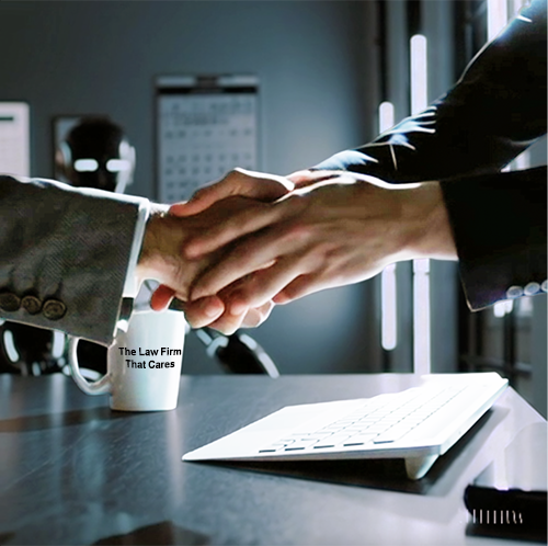 Two business people shaking hands over a desk with a coffee cup that says "The law firm that cares."