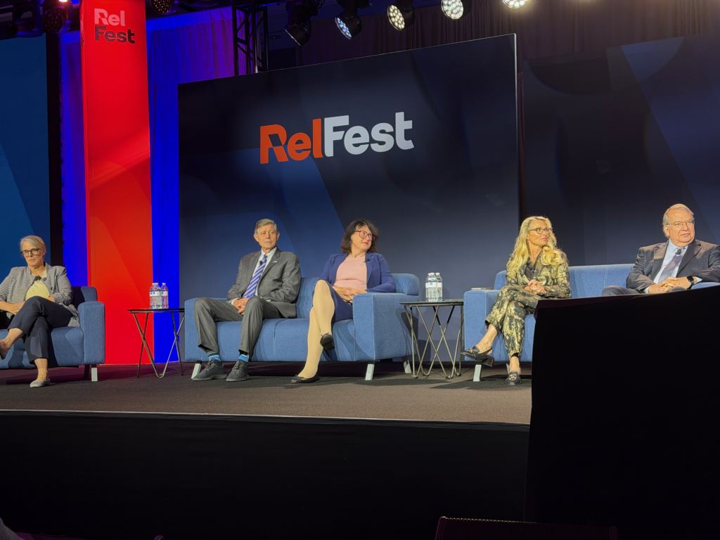 Five Judges seated on stage at the RelFest Judicial Panel.